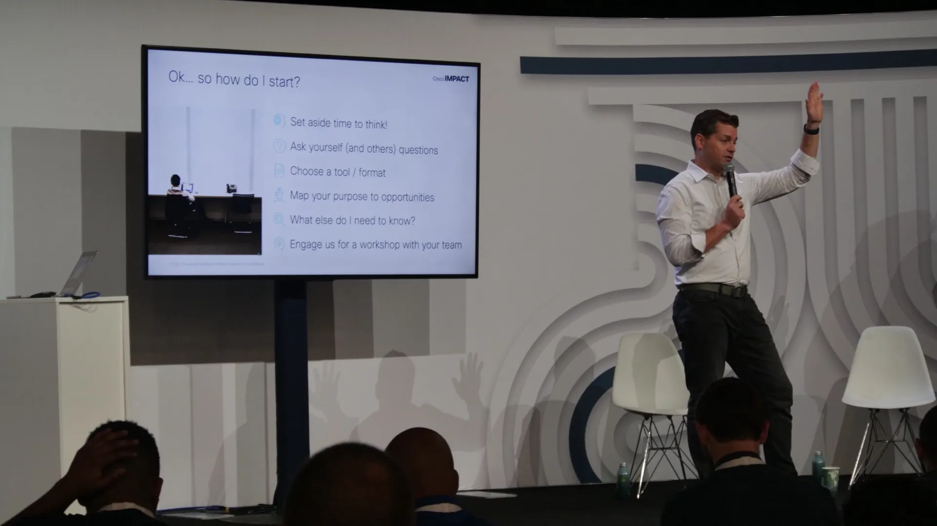 Jason Shearer speaking on stage at Cisco IMPACT